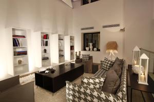 a living room with a couch and a table at Dar El Marsa Hotel & Spa in La Marsa