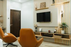 TV o dispositivi per l'intrattenimento presso Kashco Apartments Wuse 2 Abuja