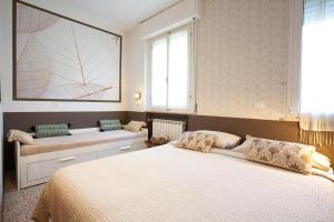 a bedroom with a large bed and a window at B&B La Volpina in Rimini +30 photos