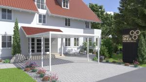 a rendering of a white house with a pavilion at Boutiquehotel Drei Ringe in Schwörstadt