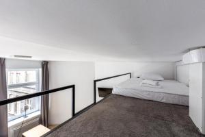 Katil atau katil-katil dalam bilik di Isabel by Q4Apartments