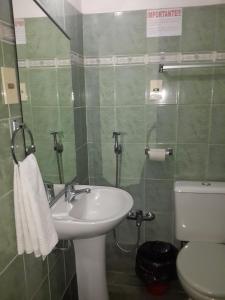 Ванная комната в Hotel A Mi Gente