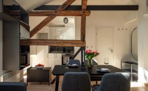 a kitchen and dining room with a table and chairs at Ruby Red House in Sofia