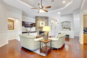 a living room with two chairs and a table at Key West Vibes in Bonita Shores in Bonita Springs