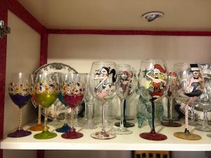 a bunch of wine glasses sitting on a shelf at Nankurunaisa in Vigo