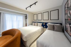 A bed or beds in a room at Charlie On The Parc Ibirapuera Hotel