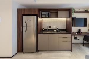 A kitchen or kitchenette at Charlie On The Parc Ibirapuera Hotel