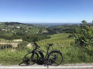 a bike parked on the side of a road at B&B TERRA DI COLLINA Relais-biker friendly-pool-sauna-jacuzzi in Montegrosso dʼAsti