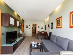 A television and/or entertainment centre at Apartment Sants-Montjuic Rambla Badal by Interhome
