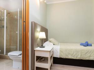 A bed or beds in a room at Apartment Sants-Montjuic Rambla Badal by Interhome