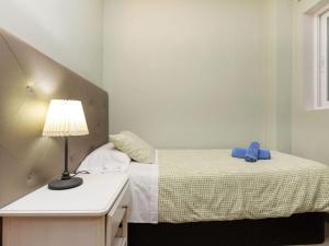 A bed or beds in a room at Apartment Sants-Montjuic Rambla Badal by Interhome