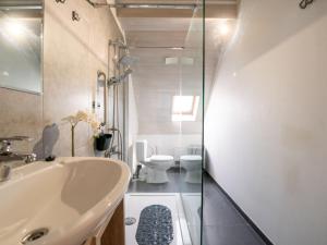 a bathroom with a sink and a toilet at Apartment Derby by Interhome in Mispelburg