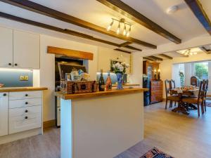 a kitchen with a counter and a dining room at 3 bed in Brompton 85761 in Brompton