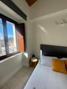 Кровать или кровати в номере Dimore Il Duomo