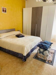 Posteľ alebo postele v izbe v ubytovaní Casa vacanza Giusi