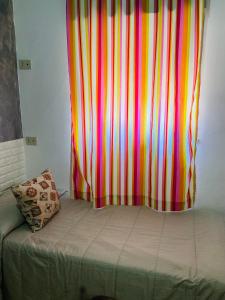 Posteľ alebo postele v izbe v ubytovaní Casa vacanza Giusi