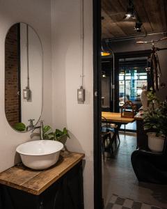 a bathroom with a sink and a mirror at Pyur Otel by Ombra House in Chiang Mai