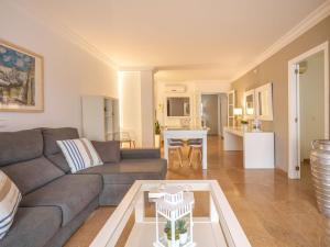 a living room with a couch and a table at Apartment Maritimo by Interhome in Port d'Alcudia