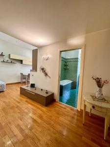 a living room with a couch and a table at Luisa Apartments in Naples
