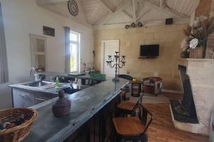 a kitchen with a sink and a counter top at Villa proche plage de l'Amélie - 3057 in Soulac-sur-Mer