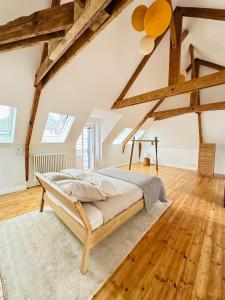 En eller flere senge i et værelse på La maison du monde - proche Gare