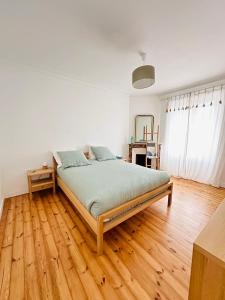 En eller flere senge i et værelse på La maison du monde - proche Gare