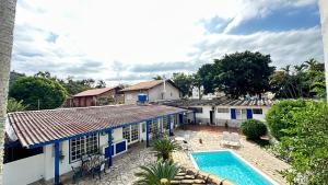 an aerial view of a house with a swimming pool at Garden 437 Suítes in Florianópolis