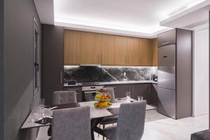 a kitchen with a table with fruit on it at Marina Apartments in Kardamyli