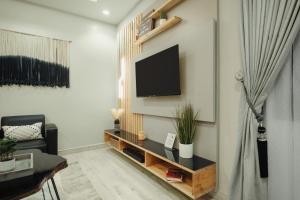 TV o dispositivi per l'intrattenimento presso Kashco Apartments Wuse 2 Abuja