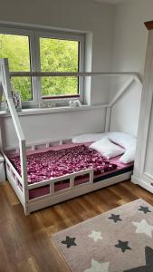 Postel nebo postele na pokoji v ubytování Familientraum