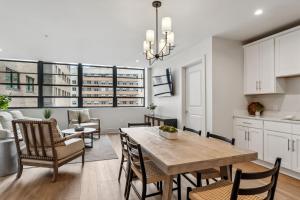 a kitchen and dining room with a table and chairs at The Eleanor New Orleans in New Orleans