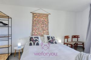 a bedroom with a bed with a welcome sign on it at weforyou Fuengirola Center Sunny & Beach in Fuengirola