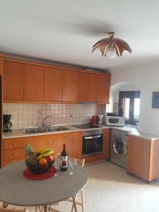 Kuchyň nebo kuchyňský kout v ubytování Aggeliki's House