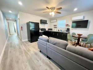a living room with a couch and a table at Tritch Cottage at Wrenwood Ranch in Johnson City