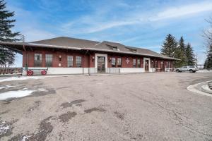 an empty parking lot in front of a building at Historic DT Laramie Apartment Deck and 1 Mi to UW! in Laramie