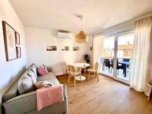 a living room with a couch and a table at Bellevue Apartments in Izola