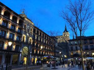 a city street with a building and a clock tower at Ave Maria Toledo in Toledo