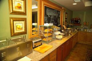 a kitchen with a counter with some food on it at Hotel Glenwood Springs in Glenwood Springs