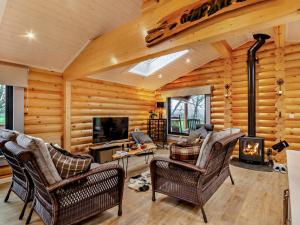 a living room filled with furniture and a fireplace at 3 Bed in Brinsley 93794 