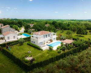 an aerial view of a house with a swimming pool at Villa Moonlight in Poreč