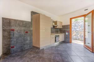 a kitchen with a sink and a counter at Casa Manes - Goelba in Rio nellʼElba