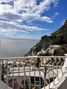 a view of the ocean from a balcony at Hostel Brikette in Positano
