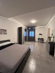 a bedroom with a bed and a desk in it at Ale Apartment in Rome