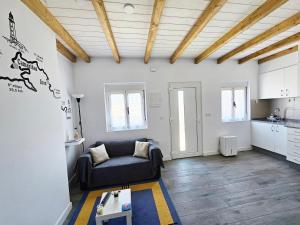 a living room with a couch and a table at Casa de Lupa - Camariñas - Costa da Morte in A Coruña