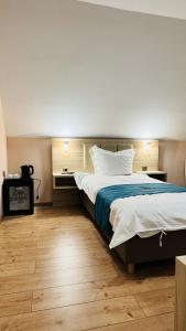 Voodi või voodid majutusasutuse Hotel Libers toas