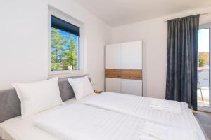 Posteľ alebo postele v izbe v ubytovaní Apartments Mialis