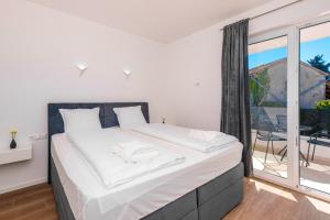 Posteľ alebo postele v izbe v ubytovaní Apartments Mialis