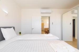 Posteľ alebo postele v izbe v ubytovaní Apartments Mialis