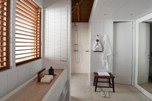 a bathroom with a shower and a sink at Le Sereno in Gustavia