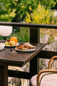 a table with two plates of food and fruit on it at Hotel Belvedere in Sperlonga +37 photos